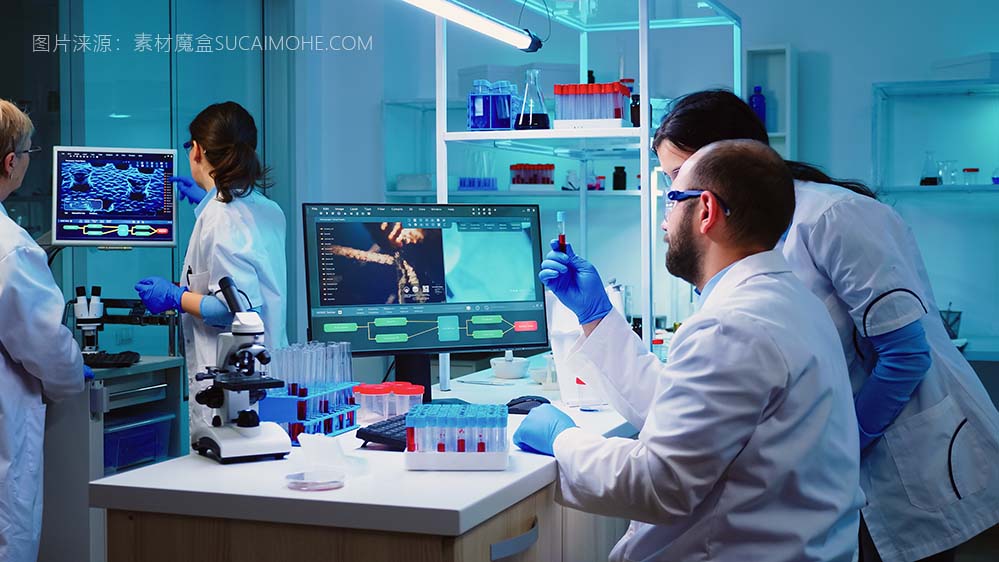 微生物学家医生在实验室背景下用分析机器从机架上取血样管